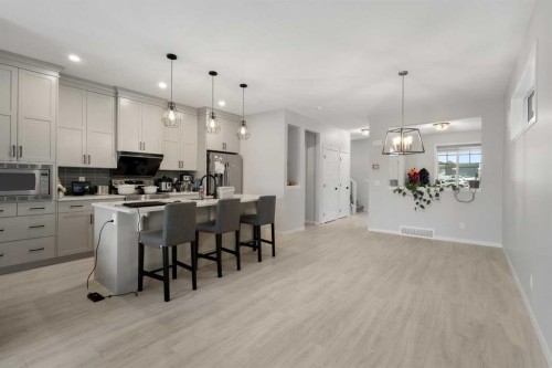 22 Edith Manor Nw, Calgary, AB - Indoor Photo Showing Kitchen With Upgraded Kitchen