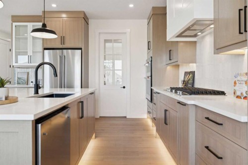 6 Westmount Point, Okotoks, AB - Indoor Photo Showing Kitchen With Upgraded Kitchen