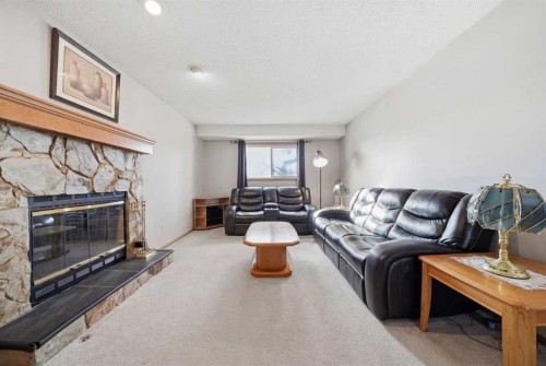 2855 Catalina Boulevard Ne, Calgary, AB - Indoor Photo Showing Living Room With Fireplace