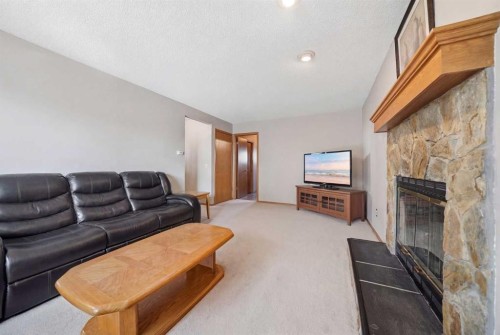 2855 Catalina Boulevard Ne, Calgary, AB - Indoor Photo Showing Living Room With Fireplace
