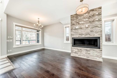 230 37 Street Nw, Calgary, AB - Indoor Photo Showing Living Room With Fireplace