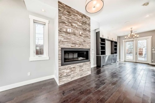 230 37 Street Nw, Calgary, AB - Indoor Photo Showing Living Room With Fireplace