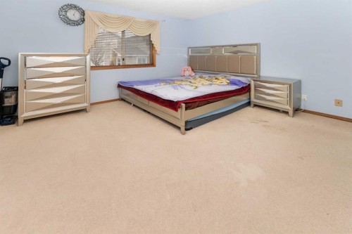 18 Coral Sands Place Ne, Calgary, AB - Indoor Photo Showing Bedroom