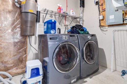 67 Elgin Meadows Park Se, Calgary, AB - Indoor Photo Showing Laundry Room