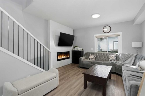 404-95 Skyview Close Ne, Calgary, AB - Indoor Photo Showing Living Room With Fireplace