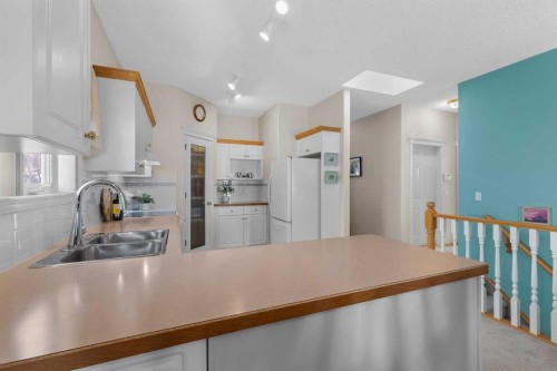 38 Scimitar Circle Nw, Calgary, AB - Indoor Photo Showing Kitchen With Double Sink