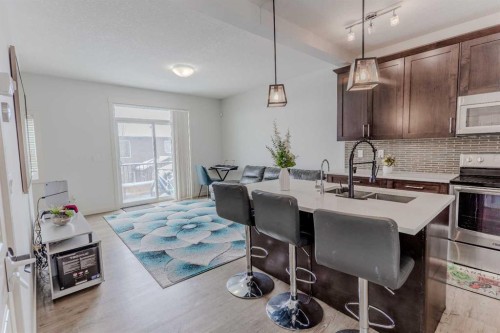 413-355 Nolancrest Heights Nw, Calgary, AB - Indoor Photo Showing Kitchen With Double Sink With Upgraded Kitchen
