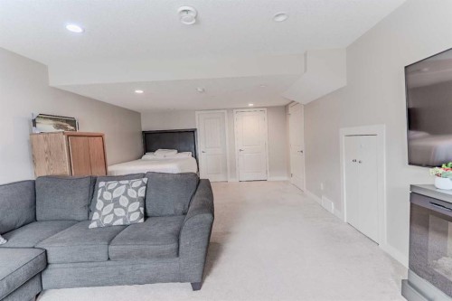 413-355 Nolancrest Heights Nw, Calgary, AB - Indoor Photo Showing Living Room With Fireplace