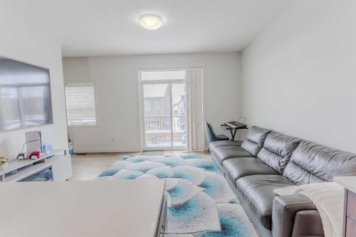 413-355 Nolancrest Heights Nw, Calgary, AB - Indoor Photo Showing Living Room