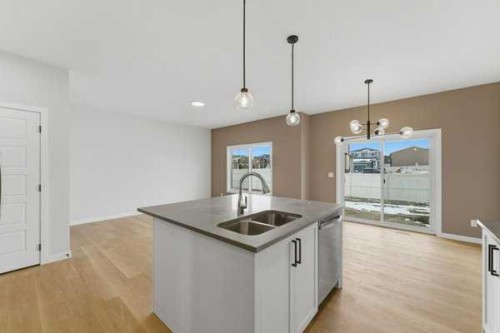 213 Bayview Park Sw, Airdrie, AB - Indoor Photo Showing Kitchen With Double Sink