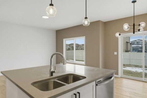 213 Bayview Park Sw, Airdrie, AB - Indoor Photo Showing Kitchen With Double Sink