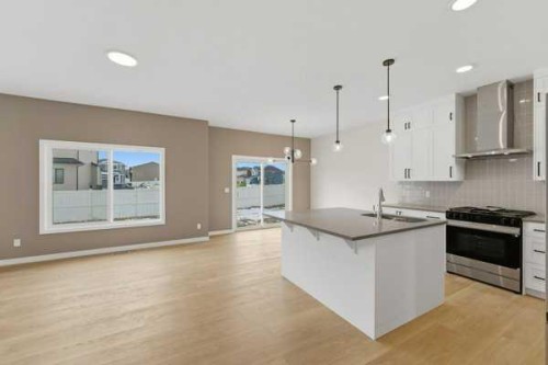 213 Bayview Park Sw, Airdrie, AB - Indoor Photo Showing Kitchen With Upgraded Kitchen