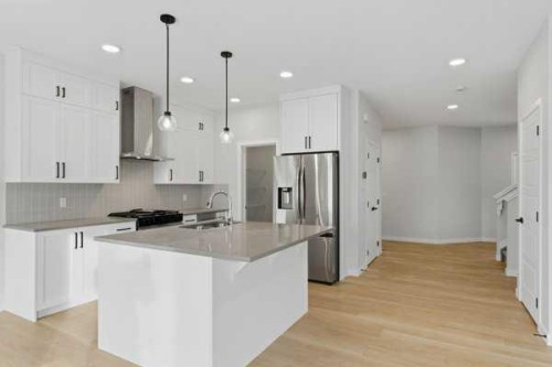 213 Bayview Park Sw, Airdrie, AB - Indoor Photo Showing Kitchen With Upgraded Kitchen