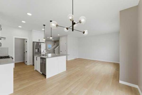 213 Bayview Park Sw, Airdrie, AB - Indoor Photo Showing Kitchen With Upgraded Kitchen