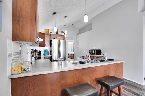 94 Inverness Park Se, Calgary, AB - Indoor Photo Showing Kitchen With Double Sink