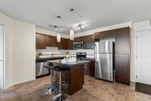 4104-279 Copperpond Common Se, Calgary, AB - Indoor Photo Showing Kitchen With Stainless Steel Kitchen With Double Sink