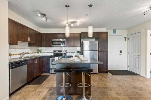 4104-279 Copperpond Common Se, Calgary, AB - Indoor Photo Showing Kitchen With Stainless Steel Kitchen With Double Sink