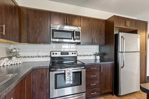4104-279 Copperpond Common Se, Calgary, AB - Indoor Photo Showing Kitchen With Stainless Steel Kitchen