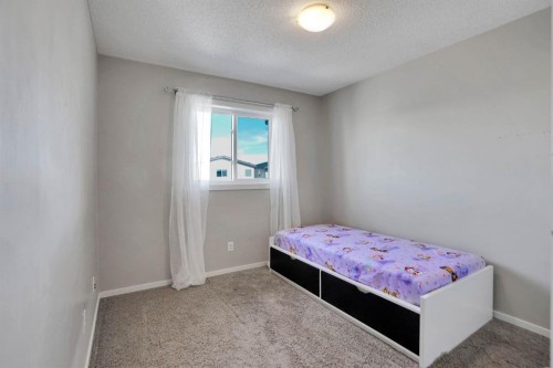 82 Walden Drive Se, Calgary, AB - Indoor Photo Showing Bedroom