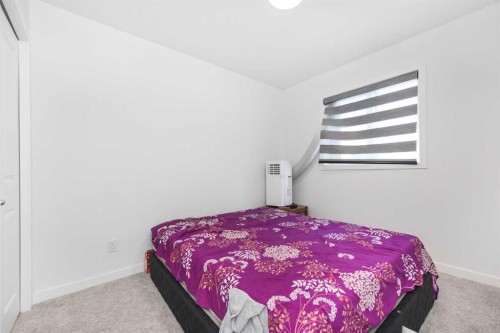399 Magnolia Drive Se, Calgary, AB - Indoor Photo Showing Bedroom