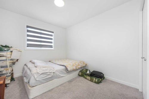 399 Magnolia Drive Se, Calgary, AB - Indoor Photo Showing Bedroom