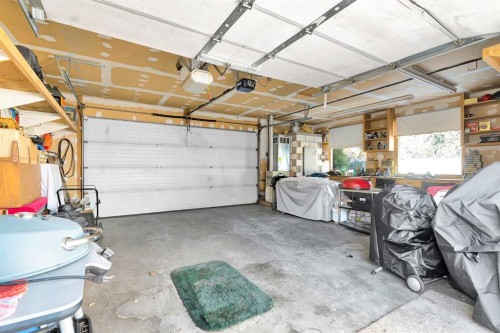 55 Midlake Place Se, Calgary, AB - Indoor Photo Showing Garage