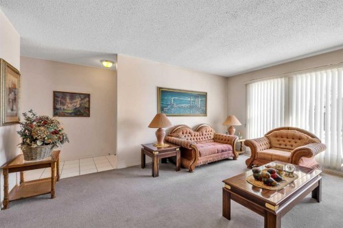 55 Midlake Place Se, Calgary, AB - Indoor Photo Showing Living Room