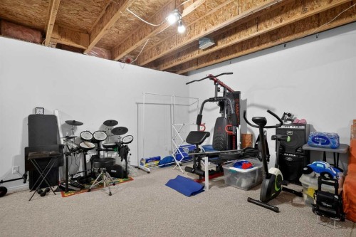260 Stonemere Place, Chestermere, AB - Indoor Photo Showing Gym Room