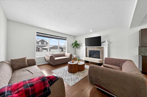 7 Redstone Park Ne, Calgary, AB - Indoor Photo Showing Living Room With Fireplace