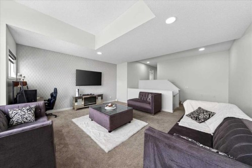 7 Redstone Park Ne, Calgary, AB - Indoor Photo Showing Living Room With Fireplace