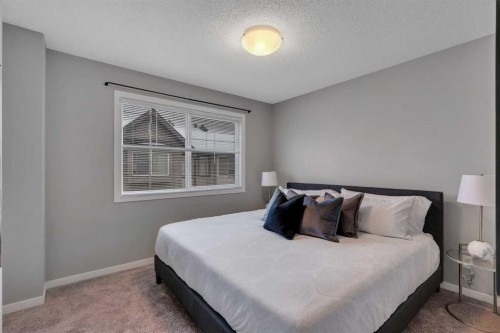 34 New Brighton Point Se, Calgary, AB - Indoor Photo Showing Bedroom