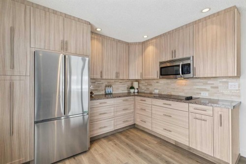 11016 Braton Place Sw, Calgary, AB - Indoor Photo Showing Kitchen With Stainless Steel Kitchen