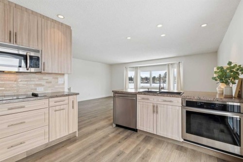 11016 Braton Place Sw, Calgary, AB - Indoor Photo Showing Kitchen