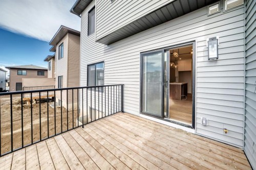 512 Heritage Boulevard, Cochrane, AB - Outdoor With Deck Patio Veranda With Exterior