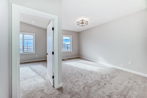 512 Heritage Boulevard, Cochrane, AB - Indoor Photo Showing Other Room