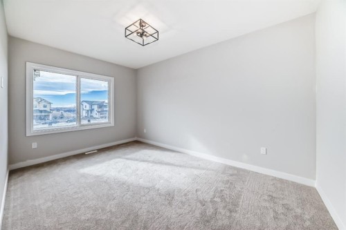 512 Heritage Boulevard, Cochrane, AB - Indoor Photo Showing Other Room