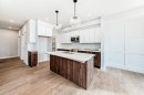 512 Heritage Boulevard, Cochrane, AB  - Indoor Photo Showing Kitchen With Double Sink 