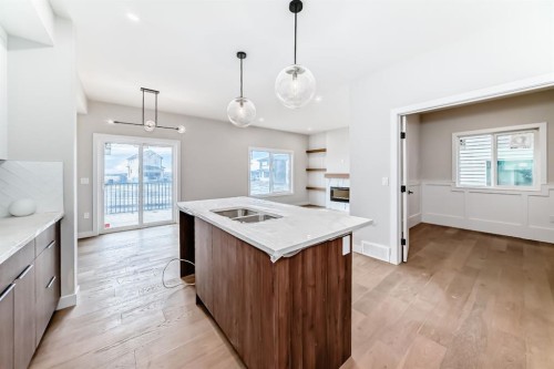 512 Heritage Boulevard, Cochrane, AB - Indoor Photo Showing Kitchen With Double Sink