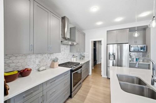 320 Sundown View, Cochrane, AB - Indoor Photo Showing Kitchen With Double Sink With Upgraded Kitchen