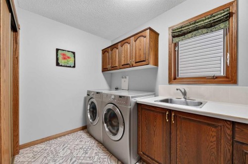 68 Hawkland Circle Nw, Calgary, AB - Indoor Photo Showing Laundry Room