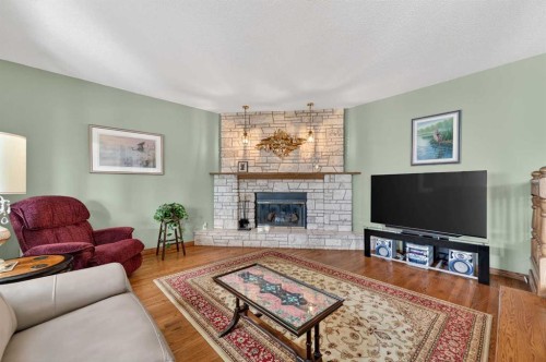 68 Hawkland Circle Nw, Calgary, AB - Indoor Photo Showing Living Room With Fireplace