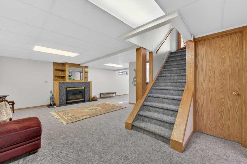 68 Hawkland Circle Nw, Calgary, AB - Indoor With Fireplace