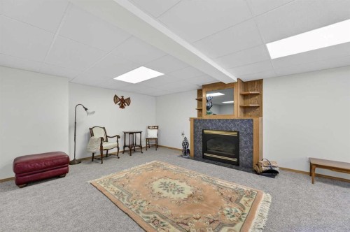 68 Hawkland Circle Nw, Calgary, AB - Indoor Photo Showing Other Room With Fireplace