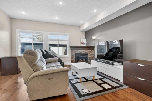 7104 36 Avenue Nw, Calgary, AB - Indoor Photo Showing Living Room With Fireplace