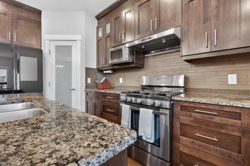 7104 36 Avenue Nw, Calgary, AB - Indoor Photo Showing Kitchen With Stainless Steel Kitchen With Double Sink With Upgraded Kitchen