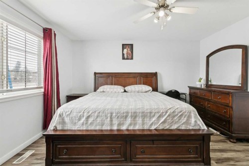 38 Canoe Square Sw, Airdrie, AB - Indoor Photo Showing Bedroom