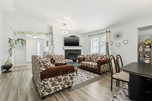 38 Canoe Square Sw, Airdrie, AB - Indoor Photo Showing Living Room With Fireplace