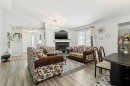 38 Canoe Square Sw, Airdrie, AB  - Indoor Photo Showing Living Room With Fireplace 