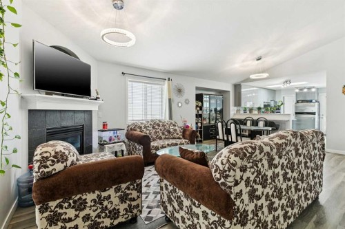 38 Canoe Square Sw, Airdrie, AB - Indoor Photo Showing Living Room With Fireplace