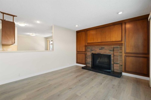 35 Shawmeadows Close Sw, Calgary, AB - Indoor Photo Showing Living Room With Fireplace